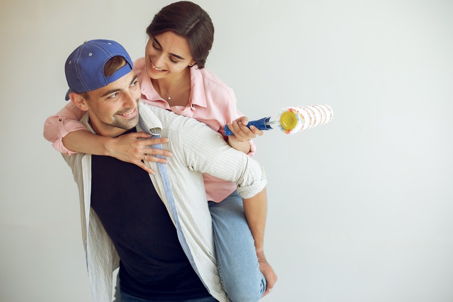 Family repairs. Couple at home. Woman in a pink blouse